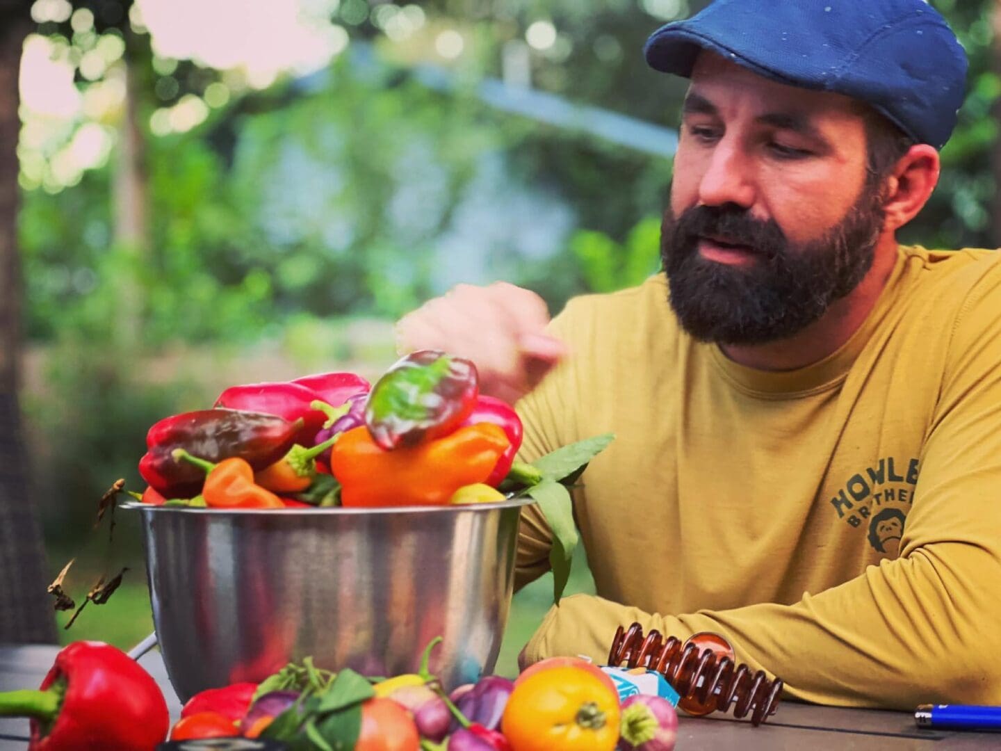 A man sitting at the table with some vegetables